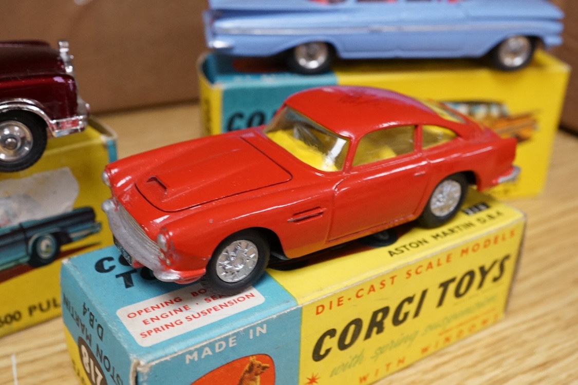 Three boxed Corgi Toys; a Mercedes-Benz 600 Pullman (247) in metallic maroon, a Chevrolet Impala (220), in sky blue with red interior, and an Aston Martin DB4 (218) in red with yellow interior. Condition - good, some dam